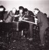 George Maciunas, Dick Higgins, Wolf Vostell, Benjamin Patterson, Emmett Williams. Performing Phillip Corner's Piano Activities at Fluxus Internationale Festspiele Neuester Musik, Wiesbaden.1962